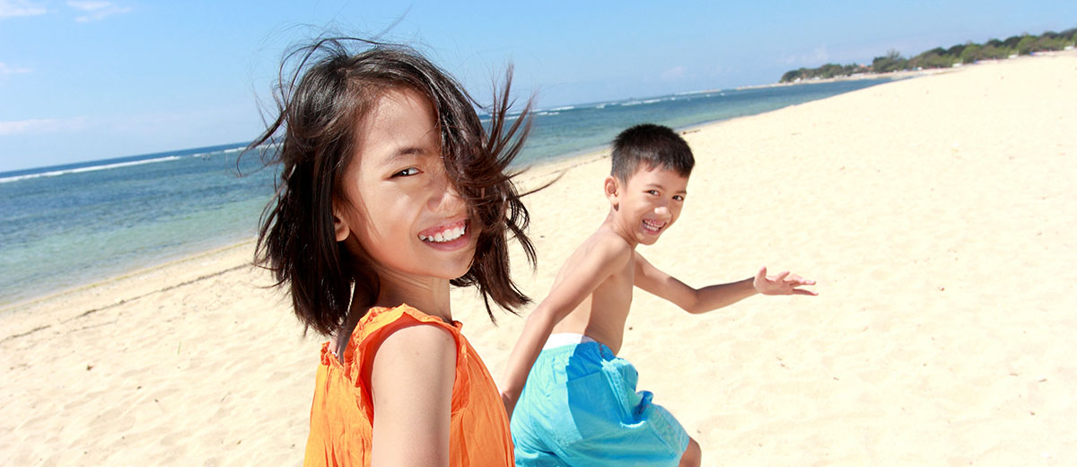 Kids running on beach