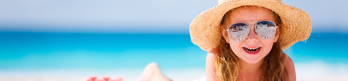 Girl on the beach with sunglasses